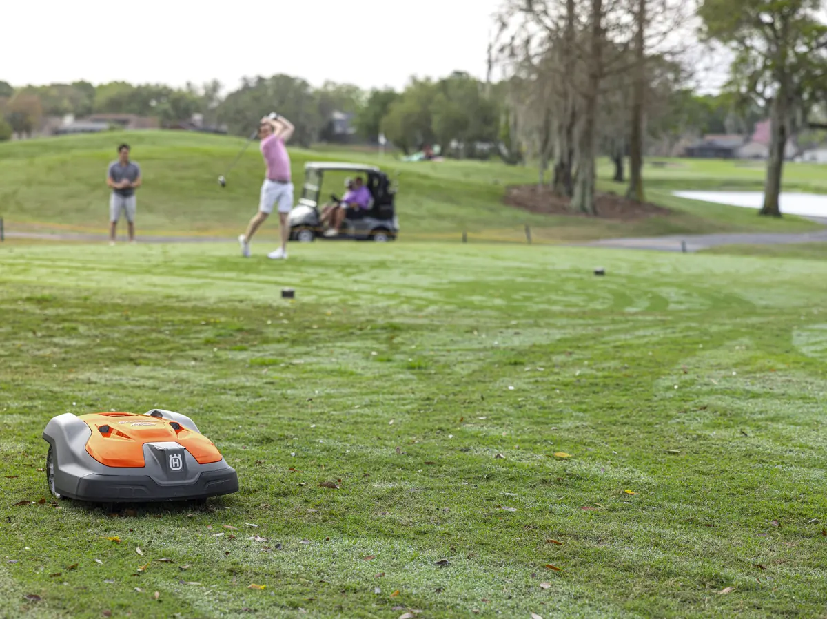 A robotic mower working on large open grounds